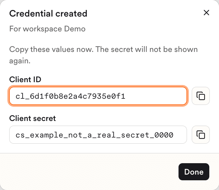 The Credential created dialog, with the Client ID and Client secret fields and the warning that the secret won't be shown again.
